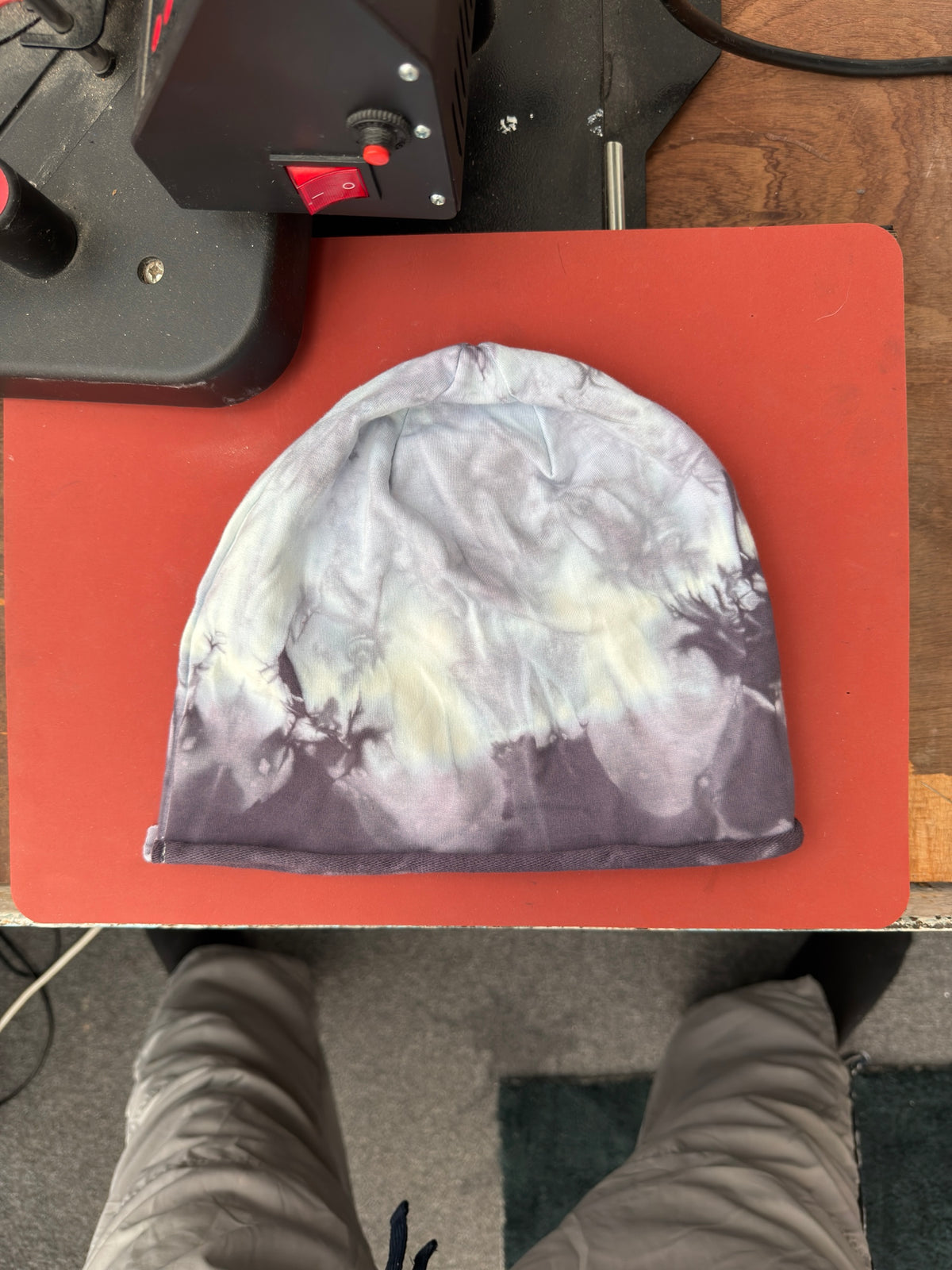 Hand-dyed beanie: light grey upper area, creamy band across middle, dark grey lower edge.