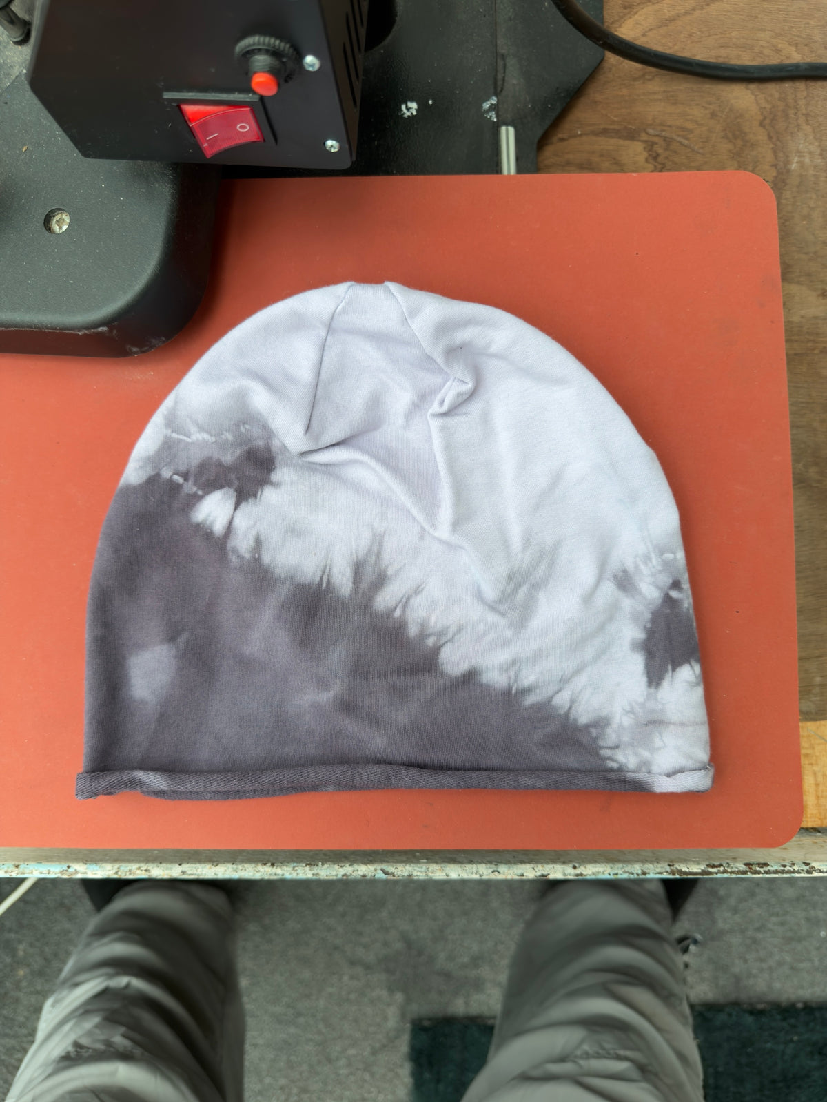 Hand-dyed beanie: pale blue-grey crown and dark grey lower-left area.