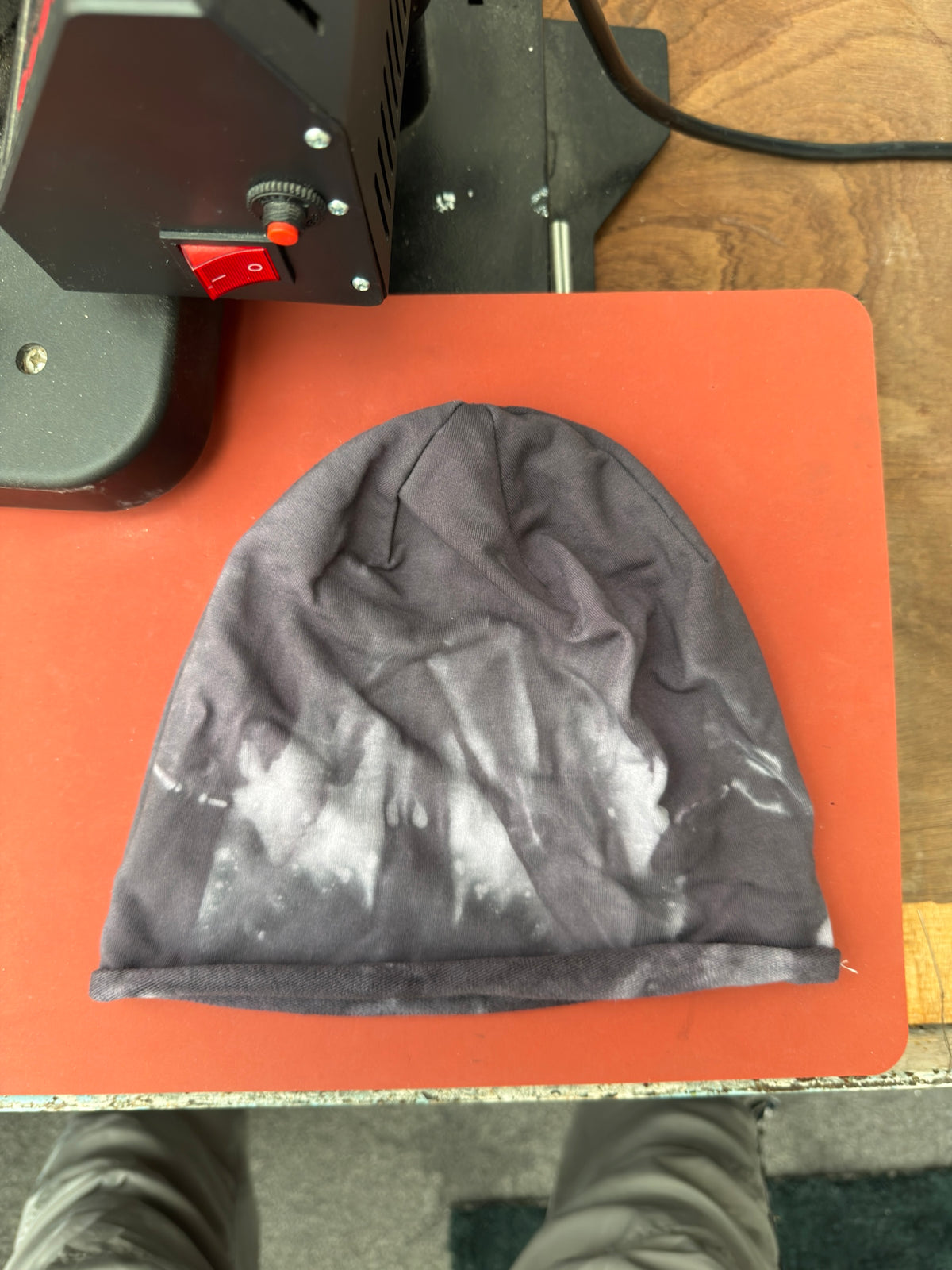 Hand-dyed beanie: dark charcoal with a pale irregular band around lower third.