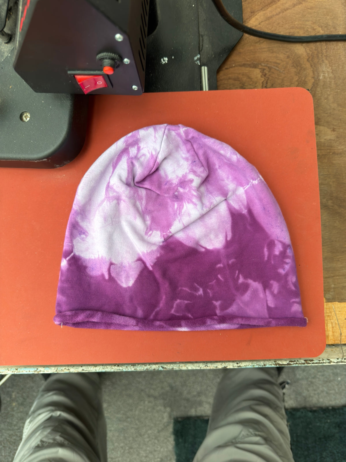 Hand-dyed beanie: purple with pale upper-left and central branching patches.