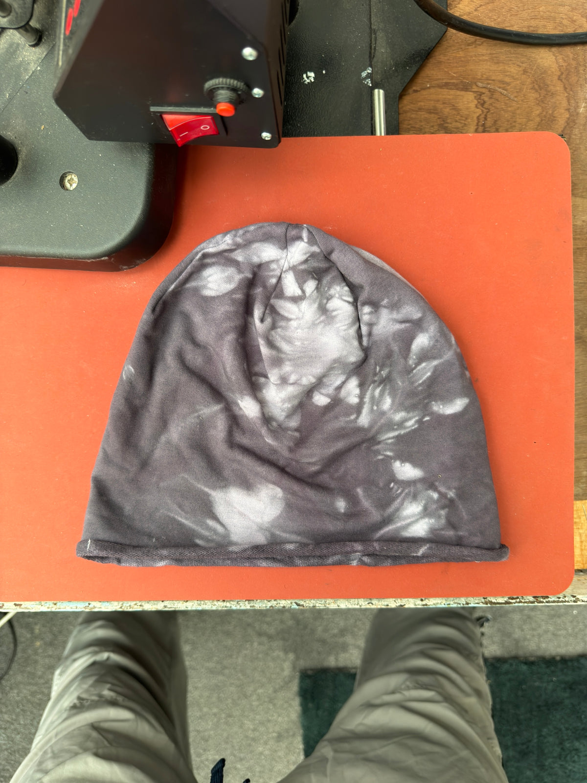 Hand-dyed beanie: charcoal grey with light crown and irregular light side patches.