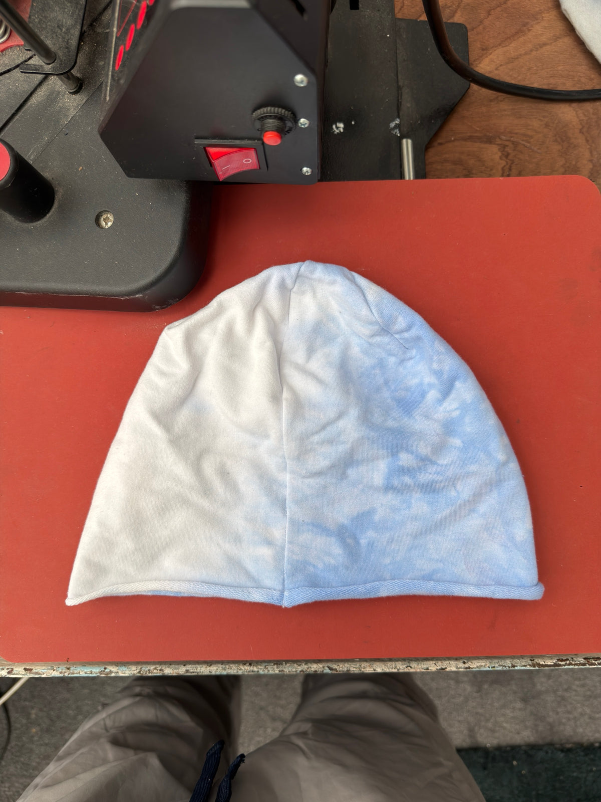 Hand-dyed beanie: very pale blue/cream with light blue right/lower area.