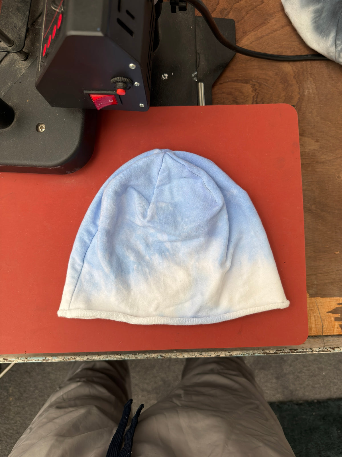 Hand-dyed beanie: light blue crown fading into pale cream at lower edge.