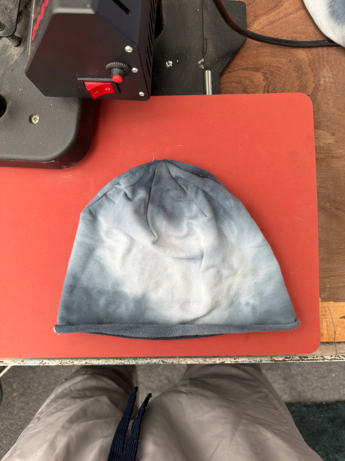 Hand-dyed beanie: dark grey crown/edges surrounding a pale cream central area.