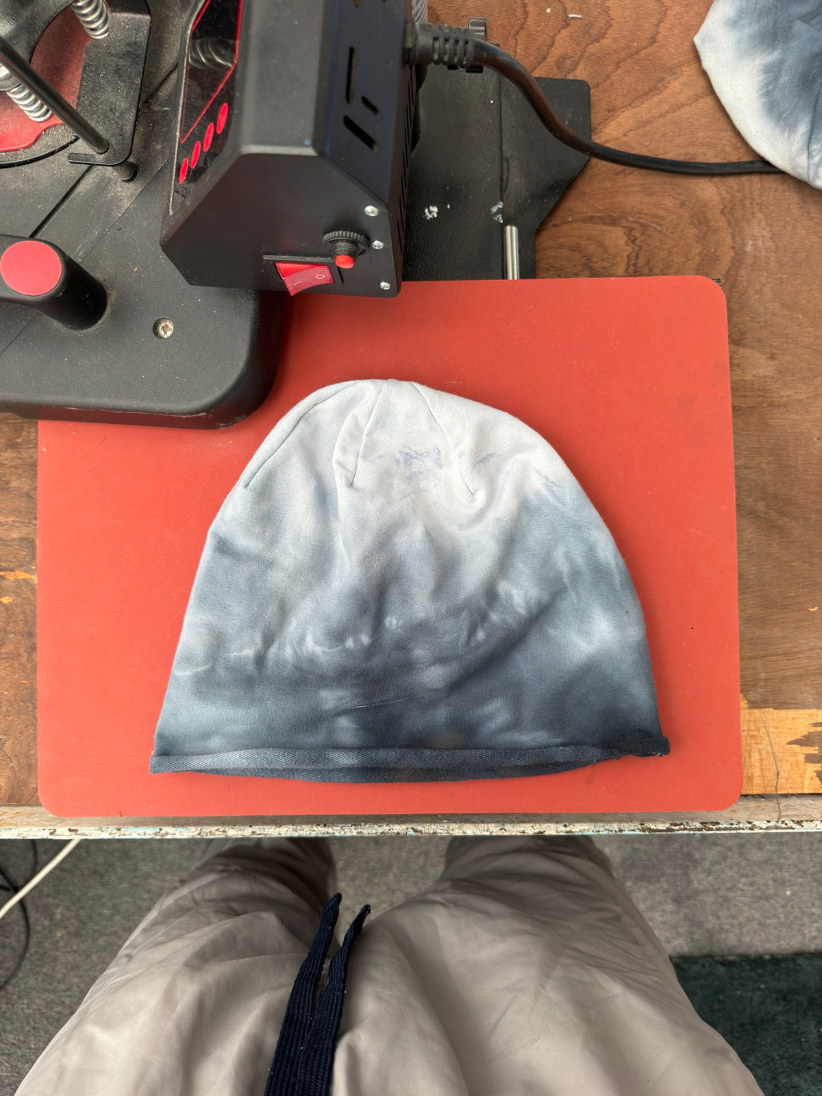 Hand-dyed beanie: pale cream/grey crown and centre fading into charcoal lower edge.