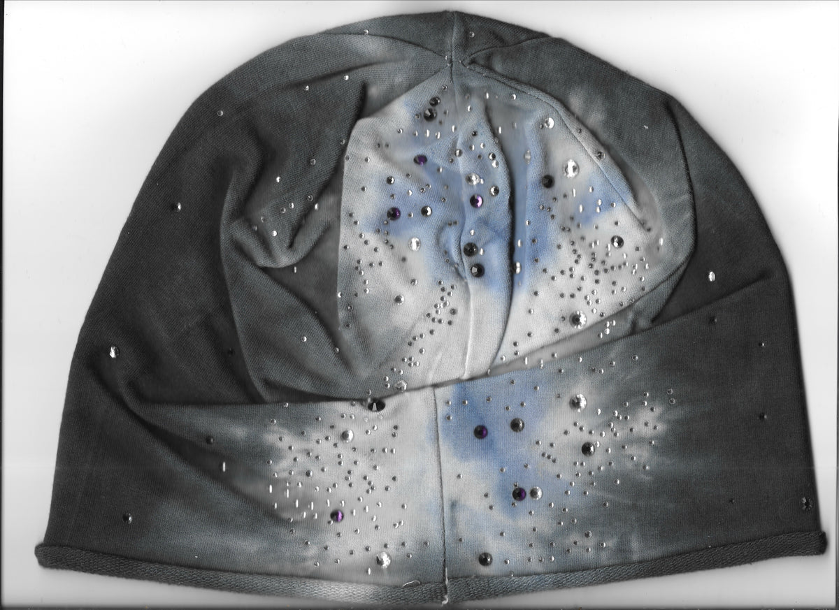 Grey-blue rhinestone beanie on a white surface.